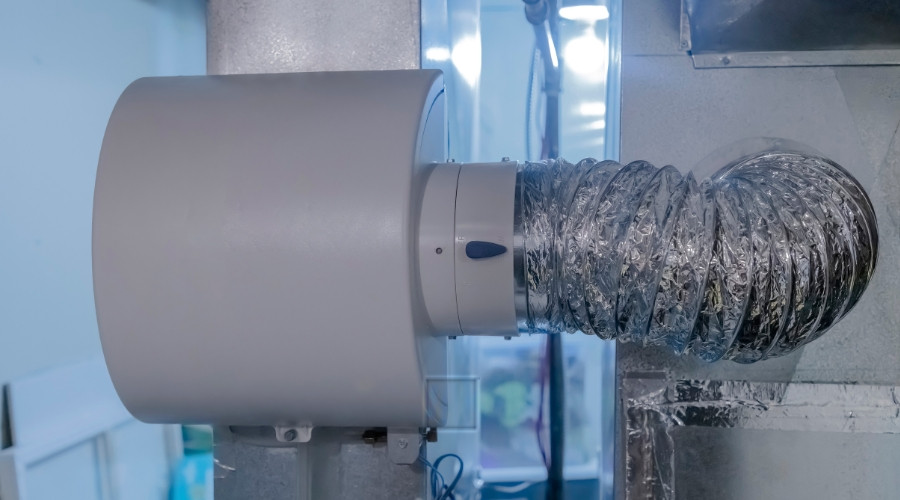 Whole house humidifier unit with ducting, illustrating HVAC system integration for moisture control in residential settings.